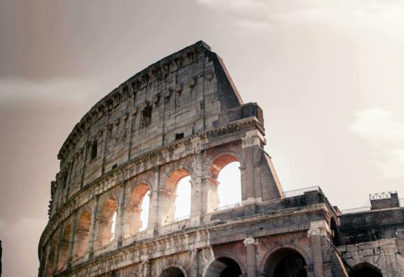 Europe Low-angle view of the Colosseum with arched stone walls