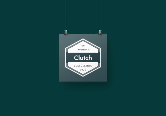 Clutch Top Business Consultants 2021 badge hanging on a dark teal background