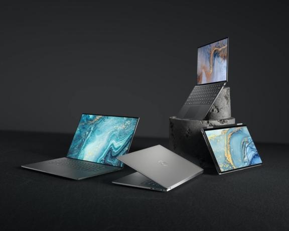Laptops and tablets displayed on a dark studio set