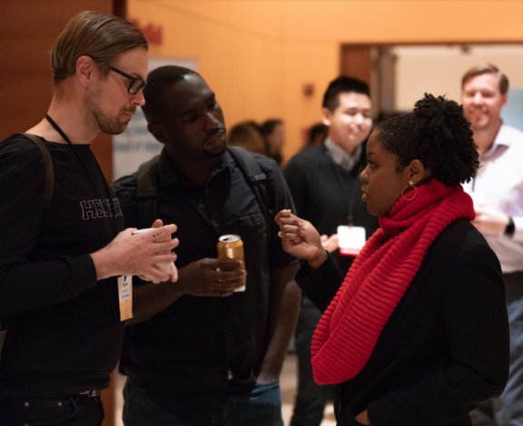 Conference attendees talking during a networking event