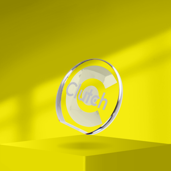 Transparent Clutch glass award floating above a yellow pedestal