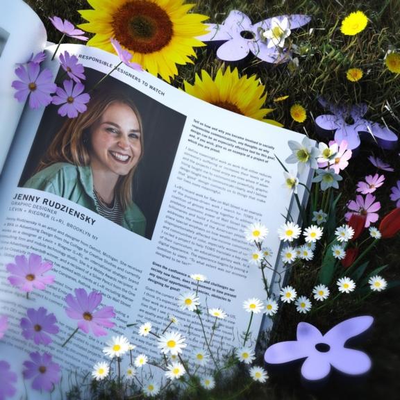Magazine spread with a portrait on grass surrounded by flowers