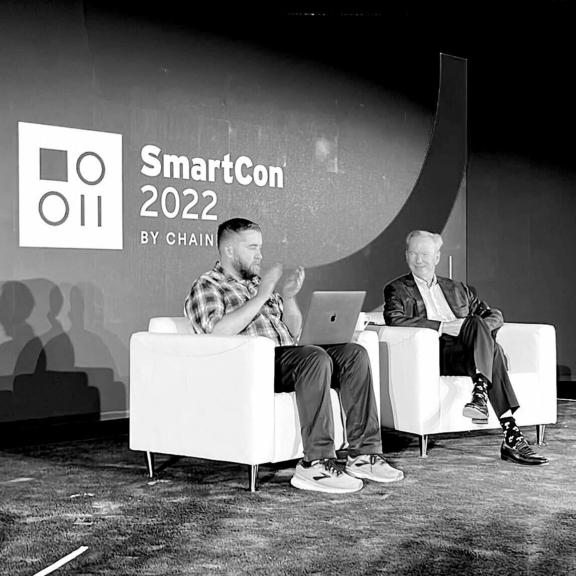 Two speakers seated onstage at SmartCon 2022 by Chainlink