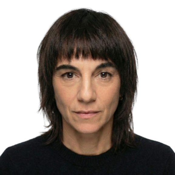 Portrait val whitebackground 1 removebg preview Headshot of a person with dark hair and bangs wearing a black sweater