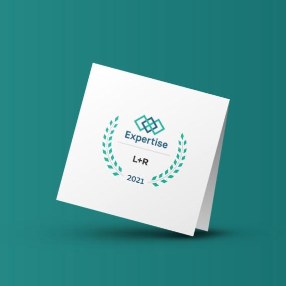 White folded card with "Expertise L+R 2021" badge on teal background
