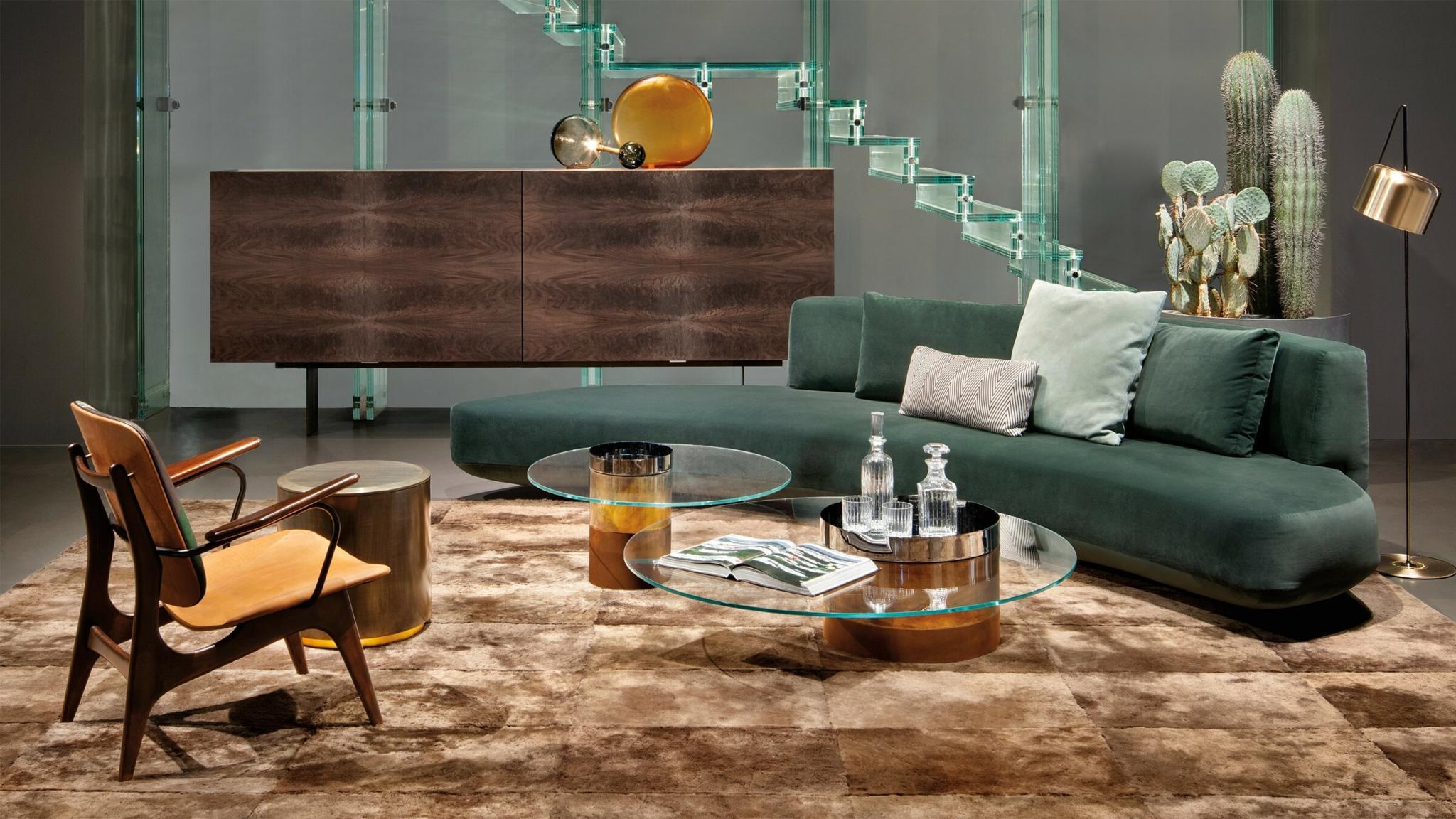Modern living room with sofa, chairs, coffee table, and wall art