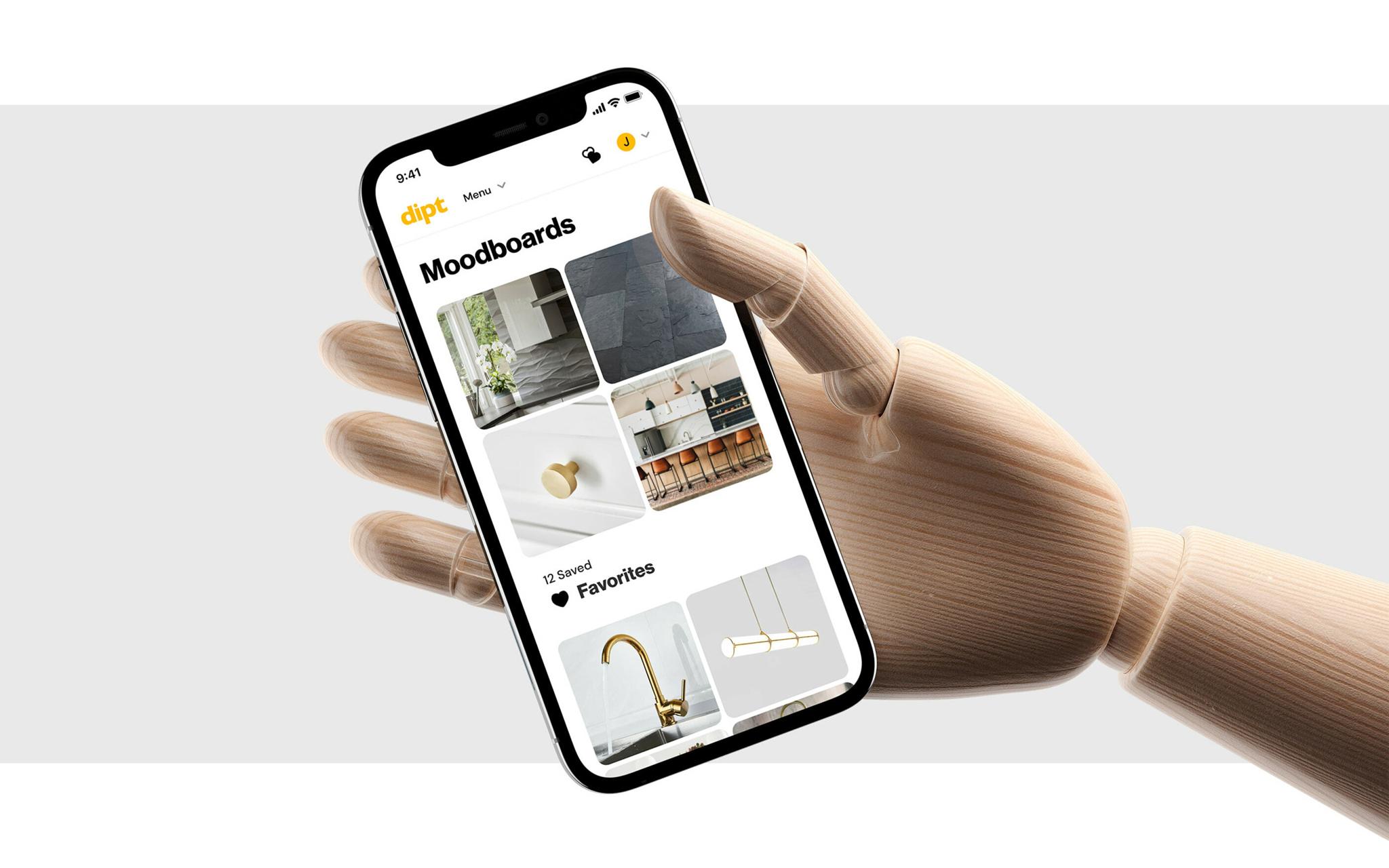 Wooden mannequin hand holding a phone with the Dipt moodboards screen