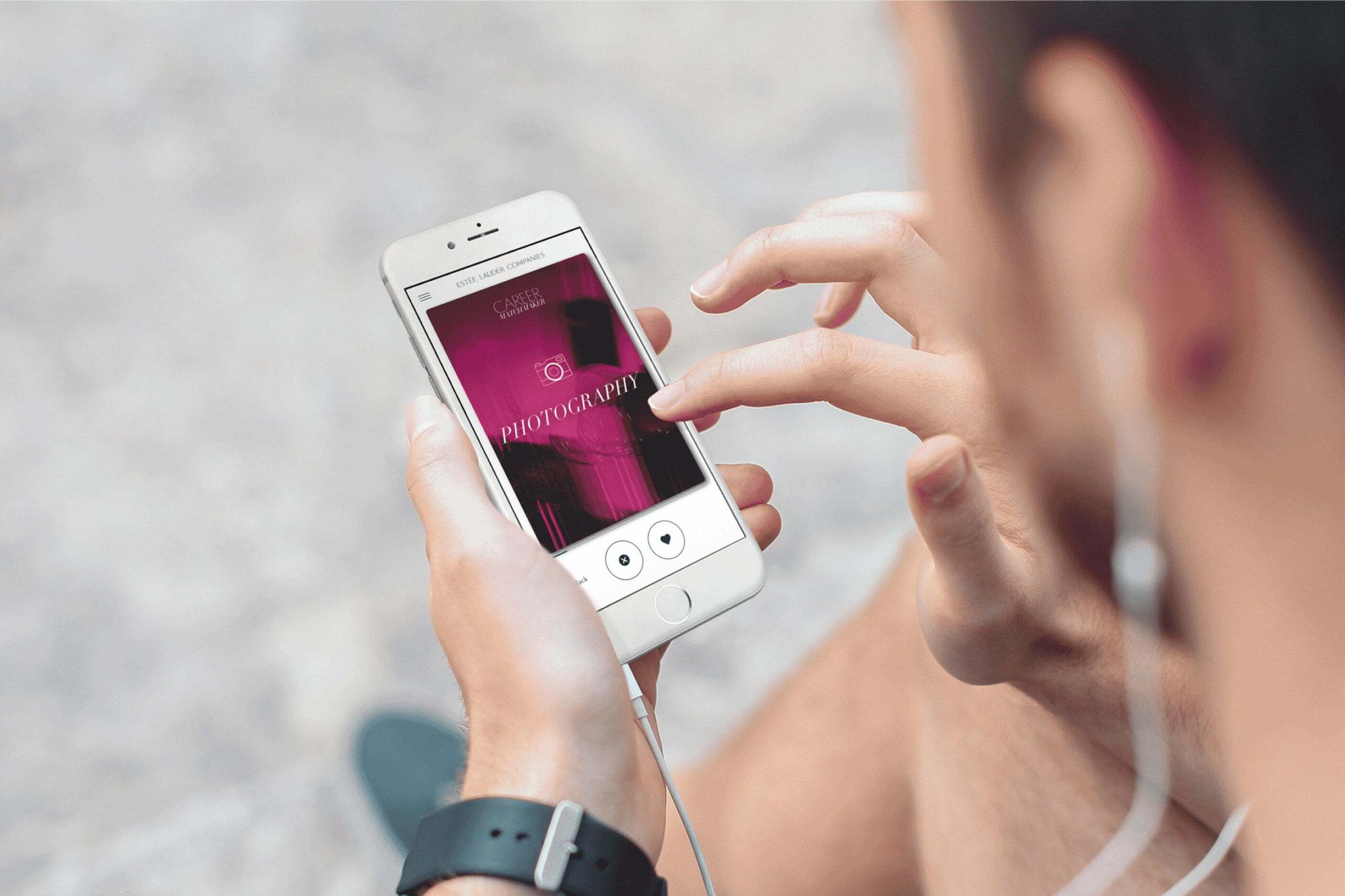 Person using a smartphone with earbuds connected