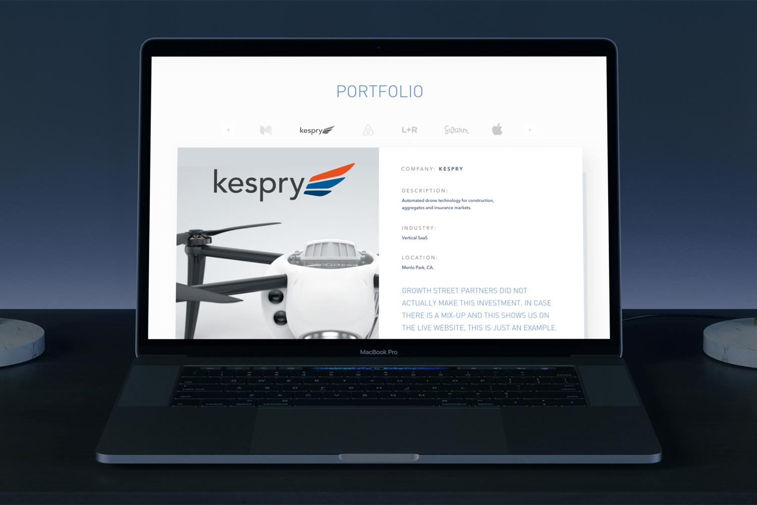 Wide laptop view showing a portfolio page for Kespry drone technology