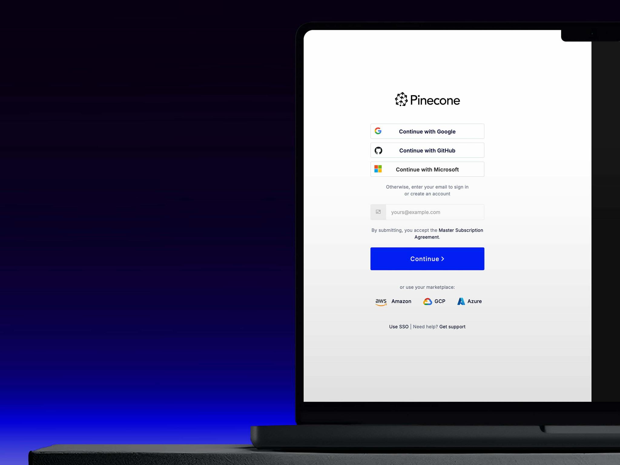 Laptop screen showing the Pinecone sign-in page against a dark blue background.