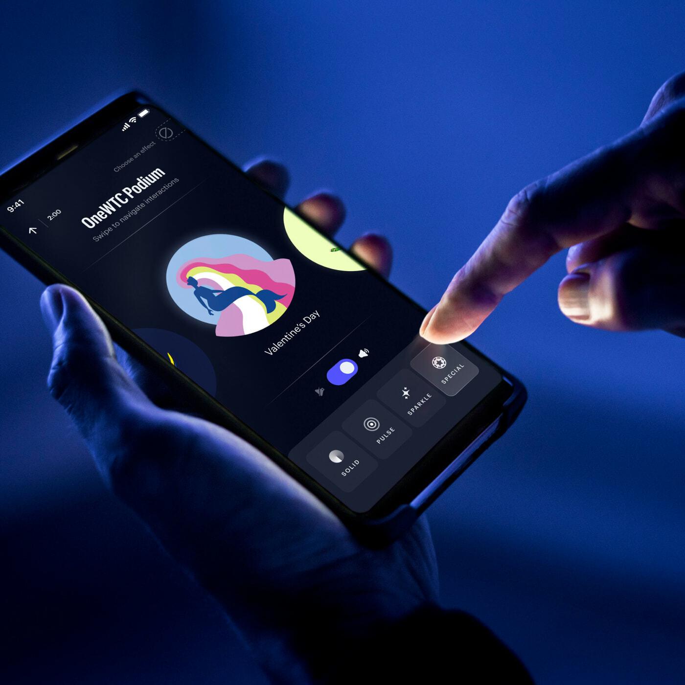 Phone app controlling a colorful lighting display in blue light