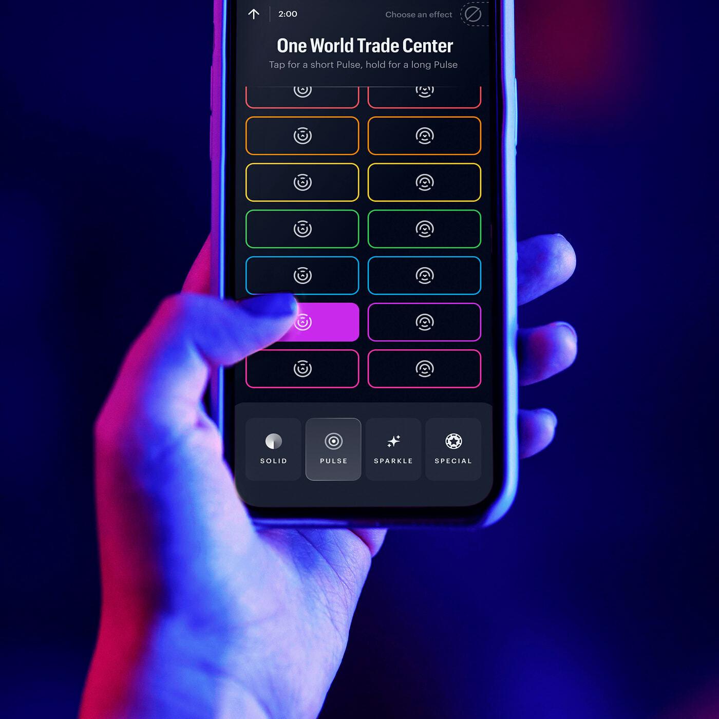 Phone screen selecting colored lighting effects for One World Trade Center