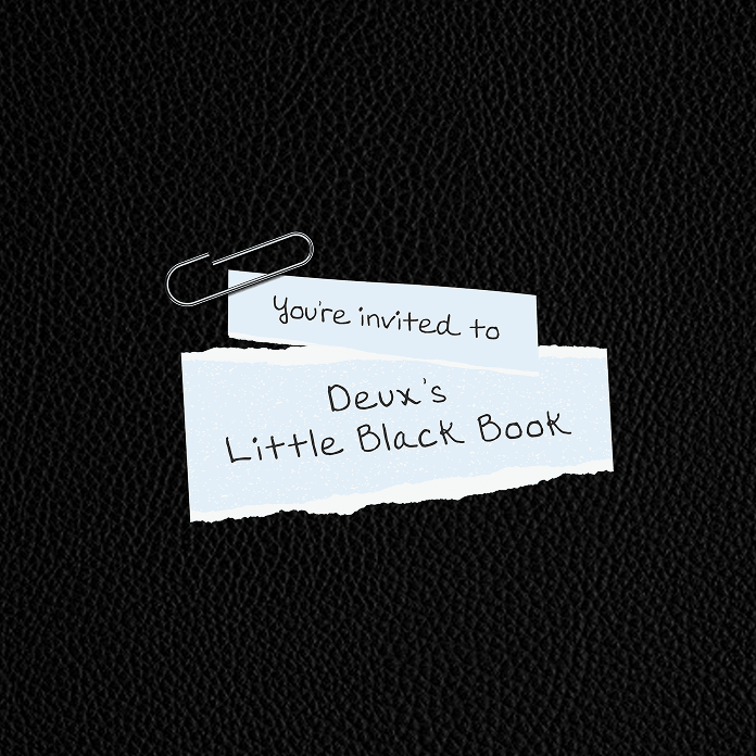 Paper note invitation to Deux's Little Black Book clipped on black leather