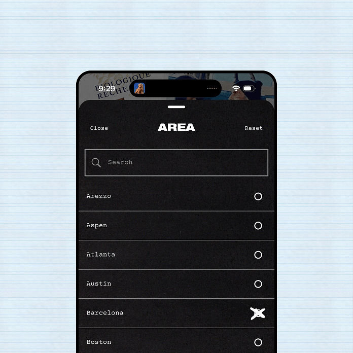 Phone screen showing an area selection list with Barcelona selected