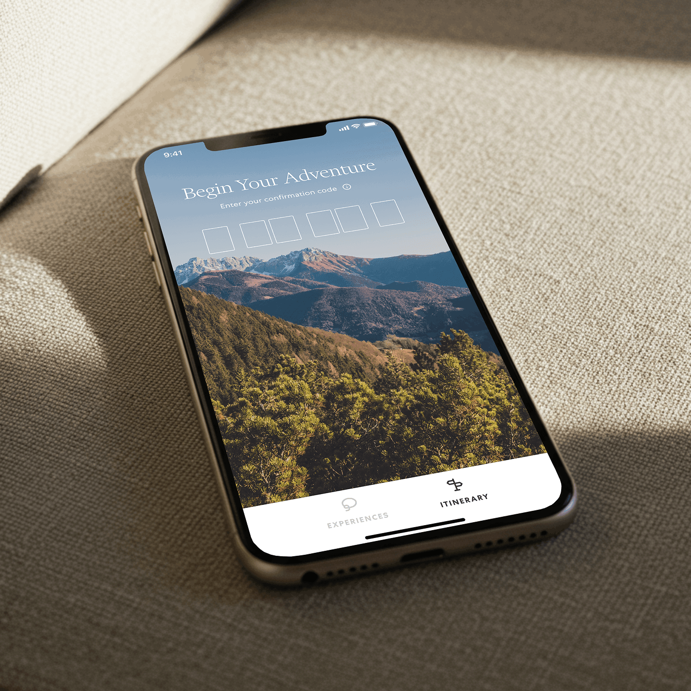 Smartphone on fabric showing a mountain adventure confirmation screen
