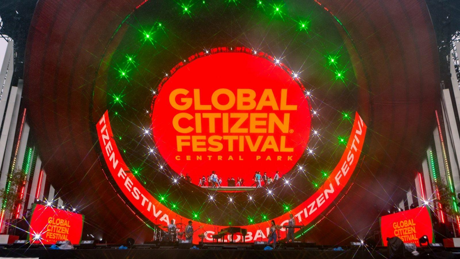 Global Citizen Festival stage with red circular screen and green lights