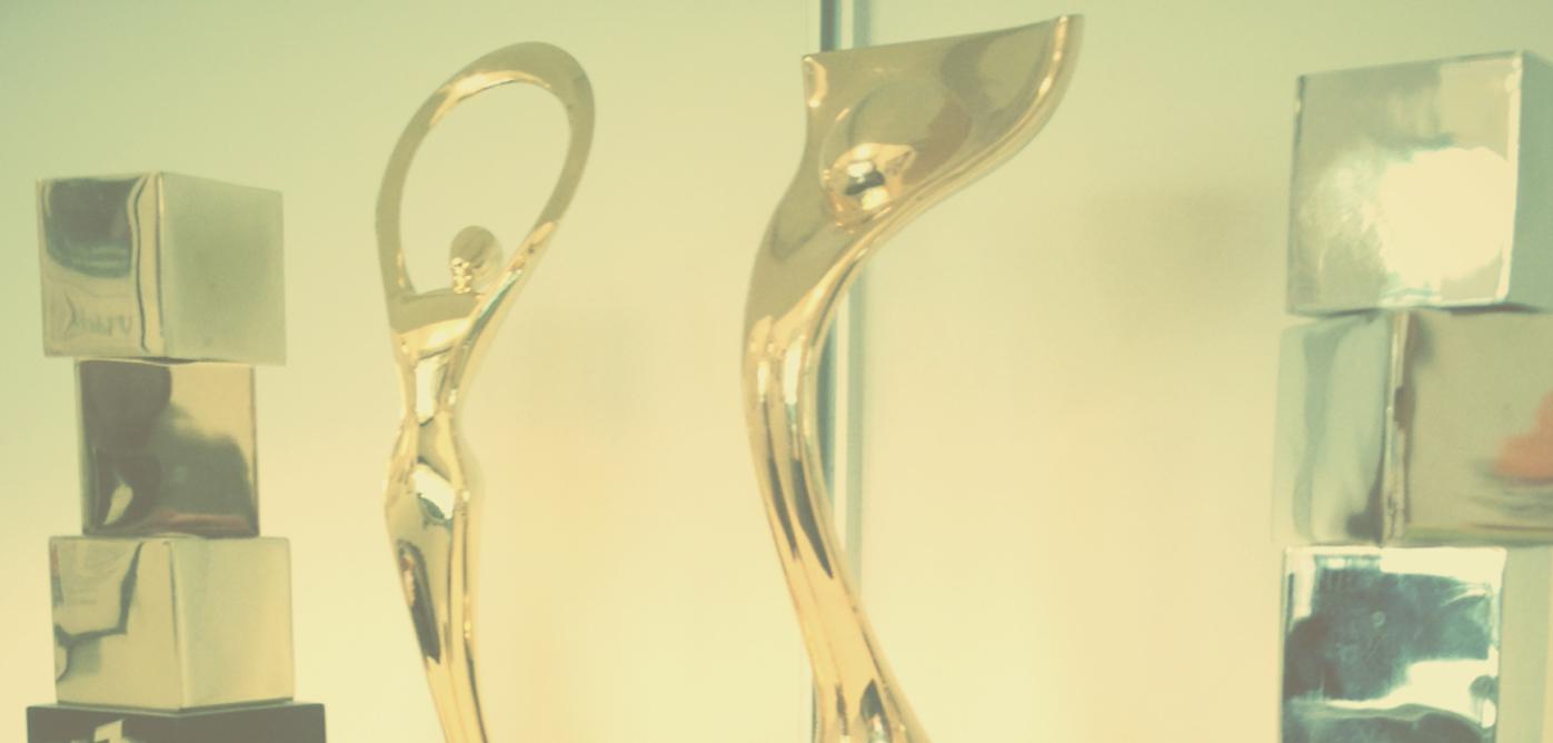 Gold and silver award trophies on display