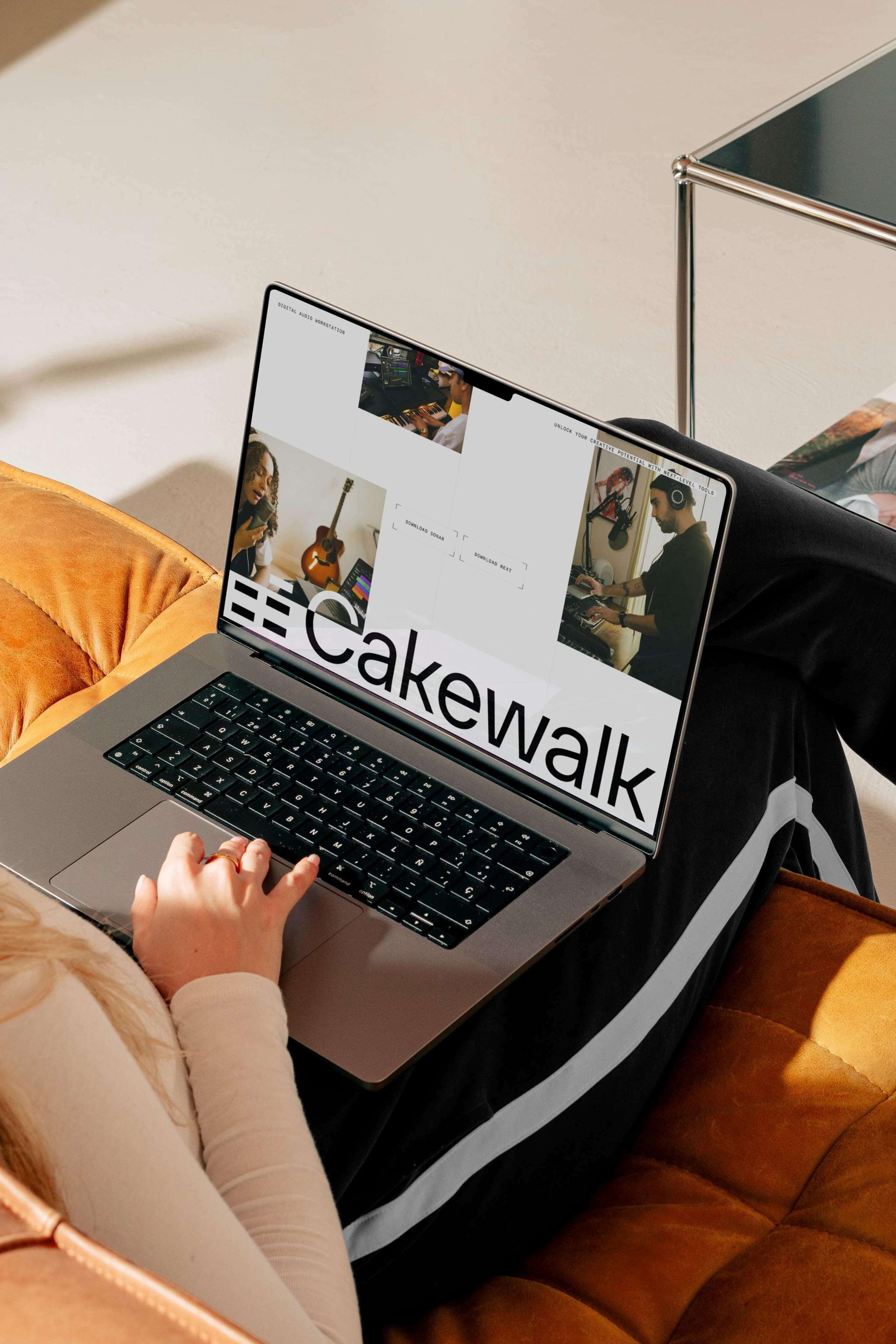Person using a laptop showing a Cakewalk music collaboration webpage