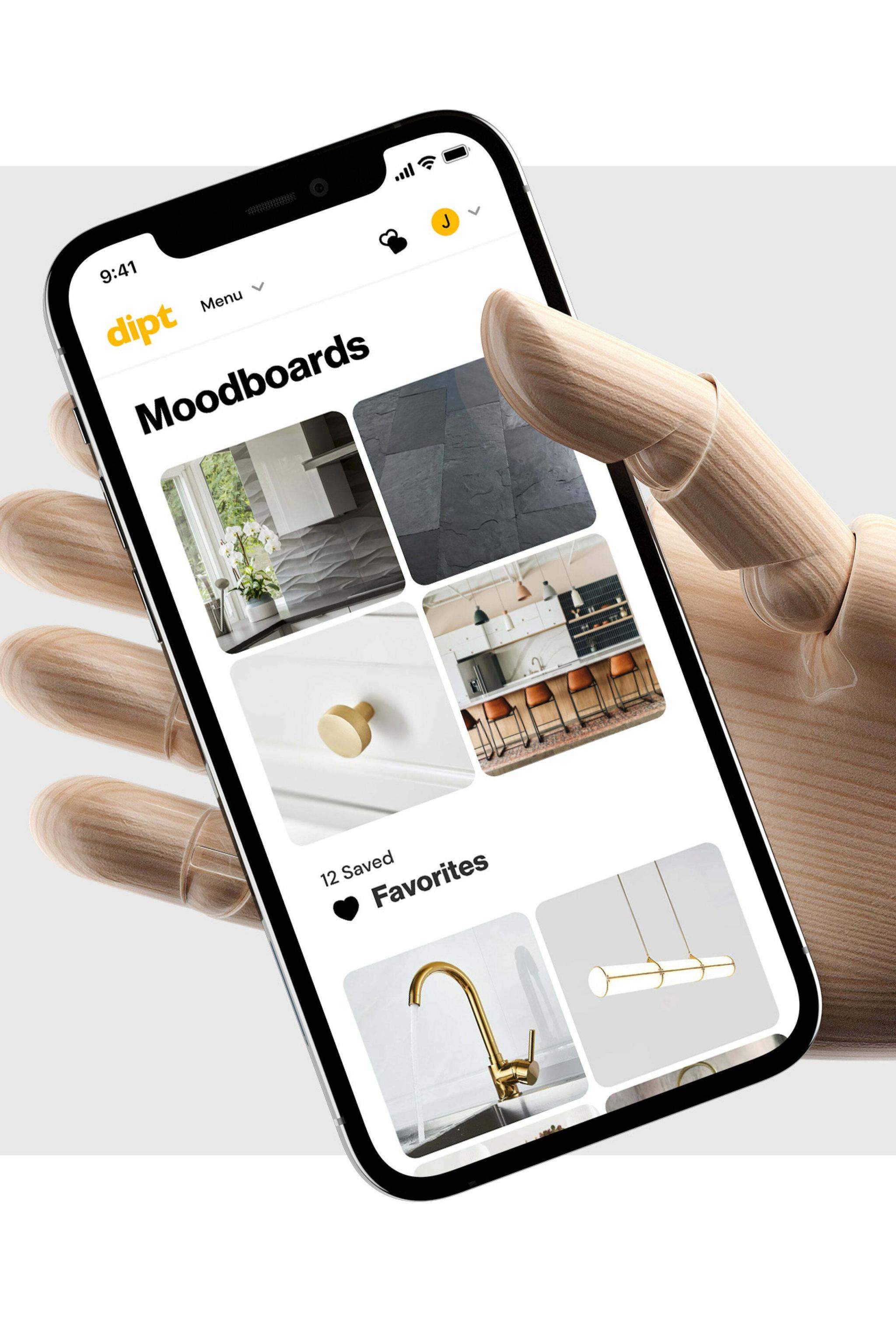 Wooden mannequin hand holding a phone showing Dipt moodboards and favorites