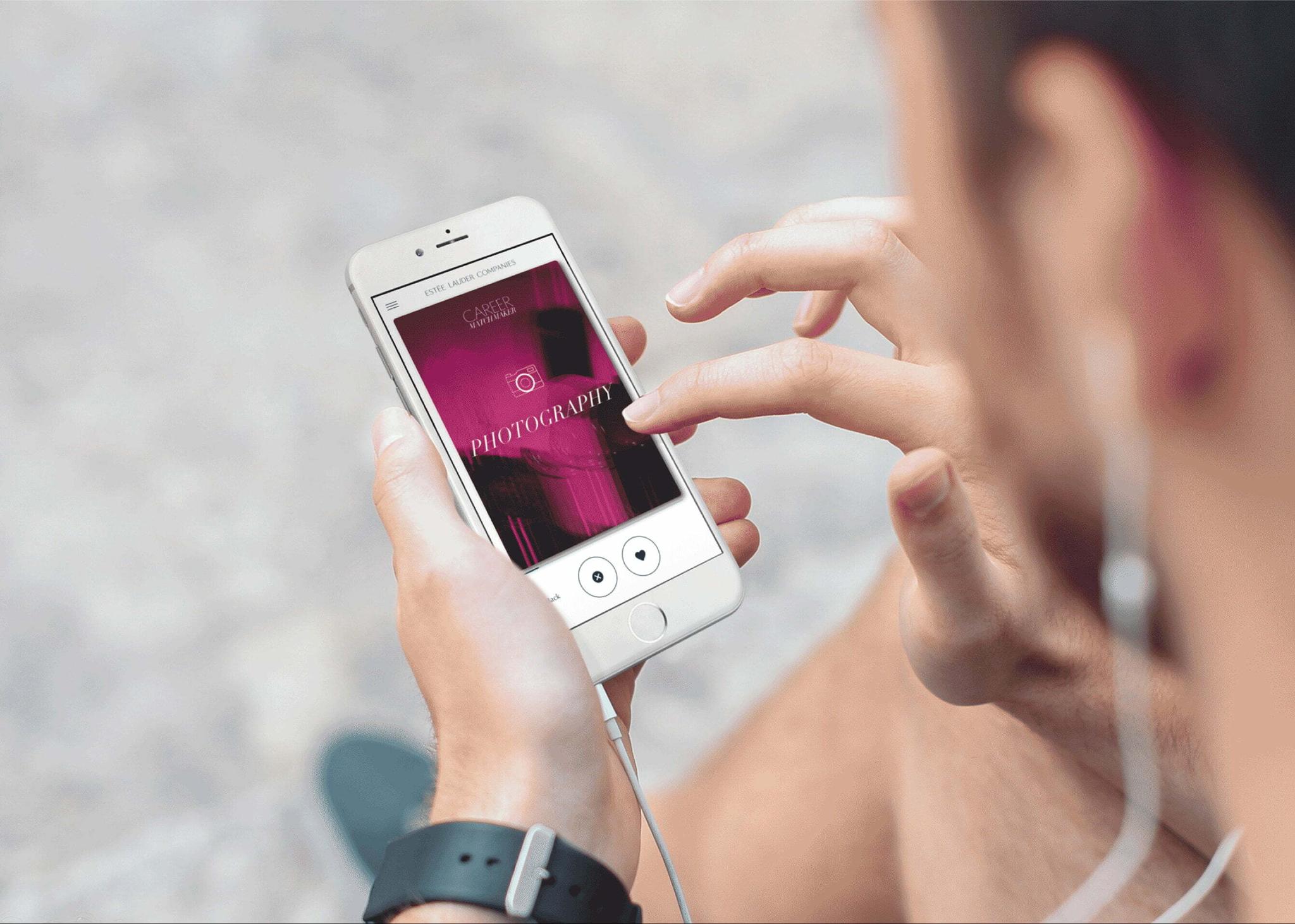 Person using a smartphone with earphones and a photography screen open