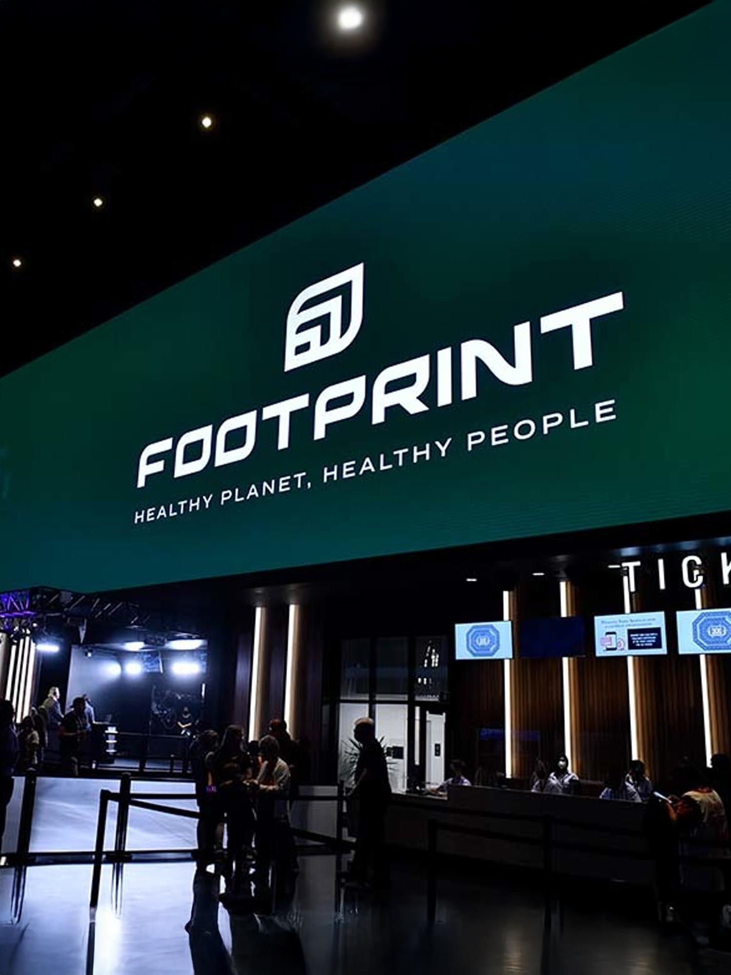FOOTPRINT event entrance with large green sign reading "Healthy planet, healthy people"