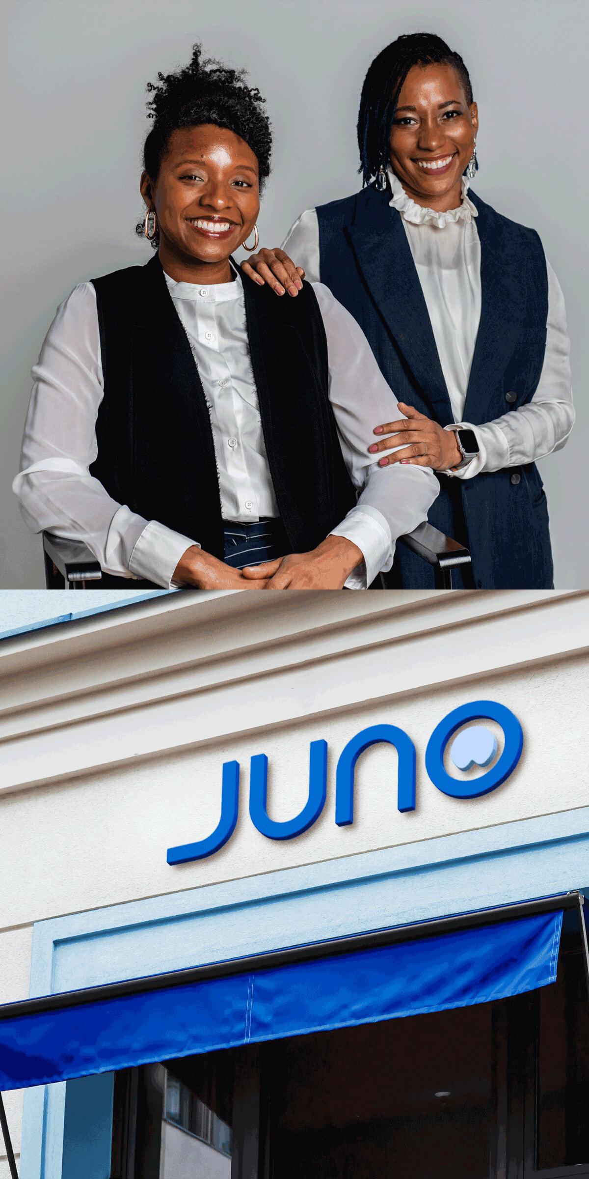Two people in business attire above a Juno storefront sign