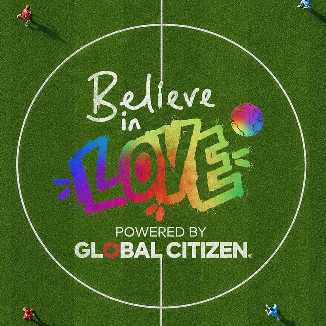 Believe in Love logo painted at midfield on a soccer pitch.