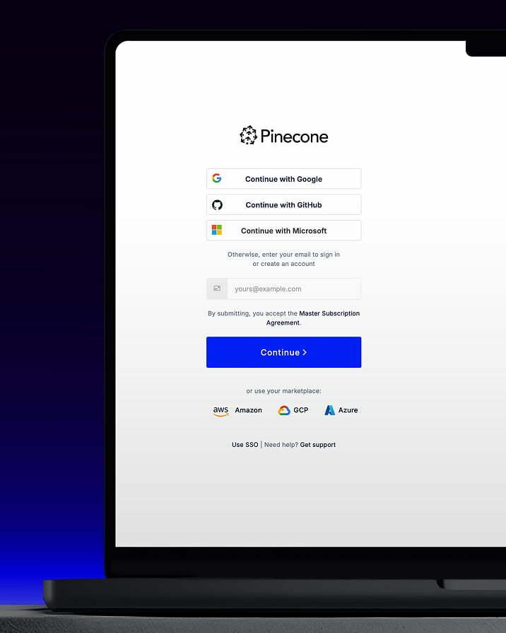 Laptop screen showing the Pinecone sign-in page against a dark blue background.