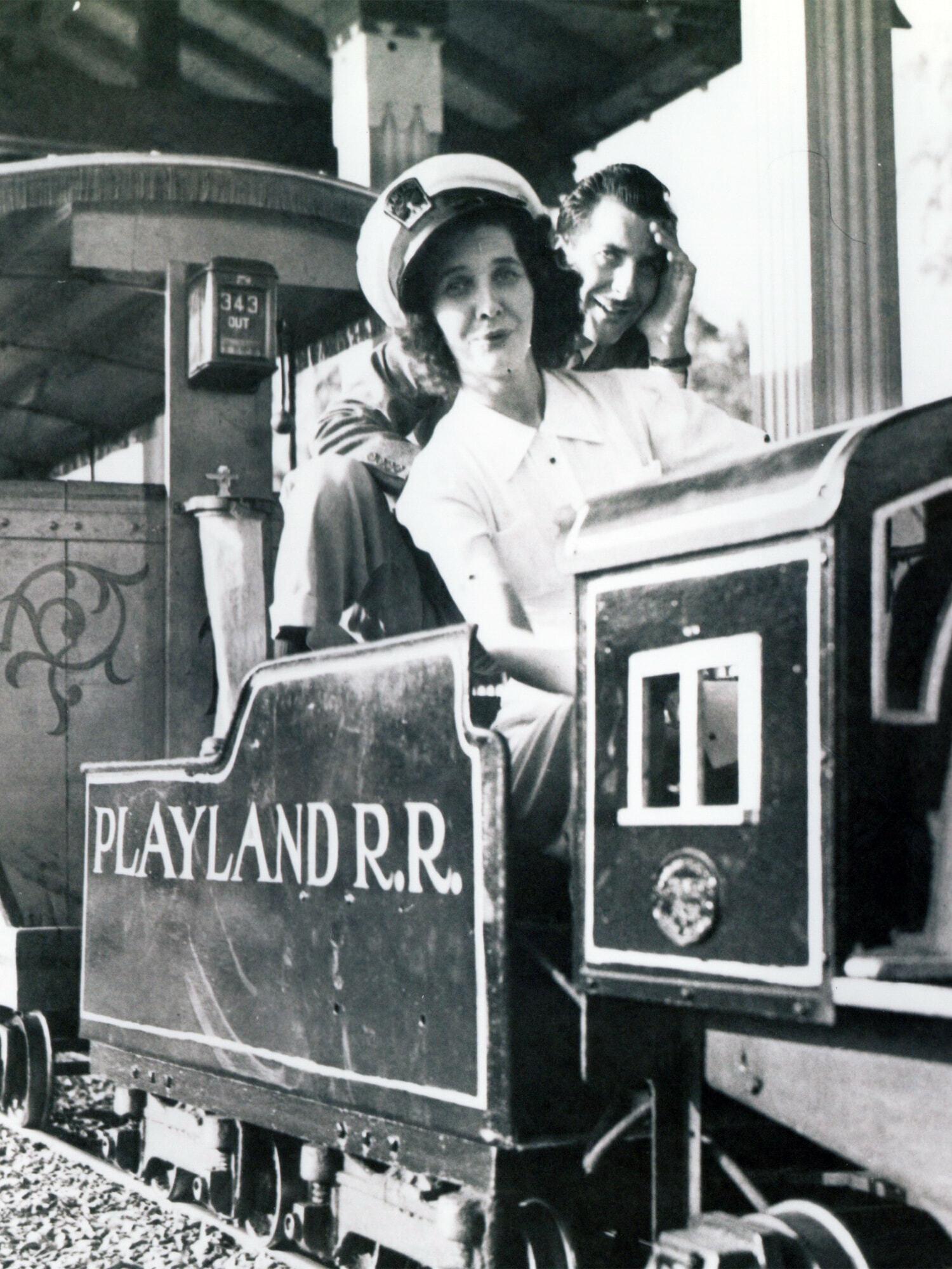 Black-and-white scene of riders on a Playland R.R. miniature train