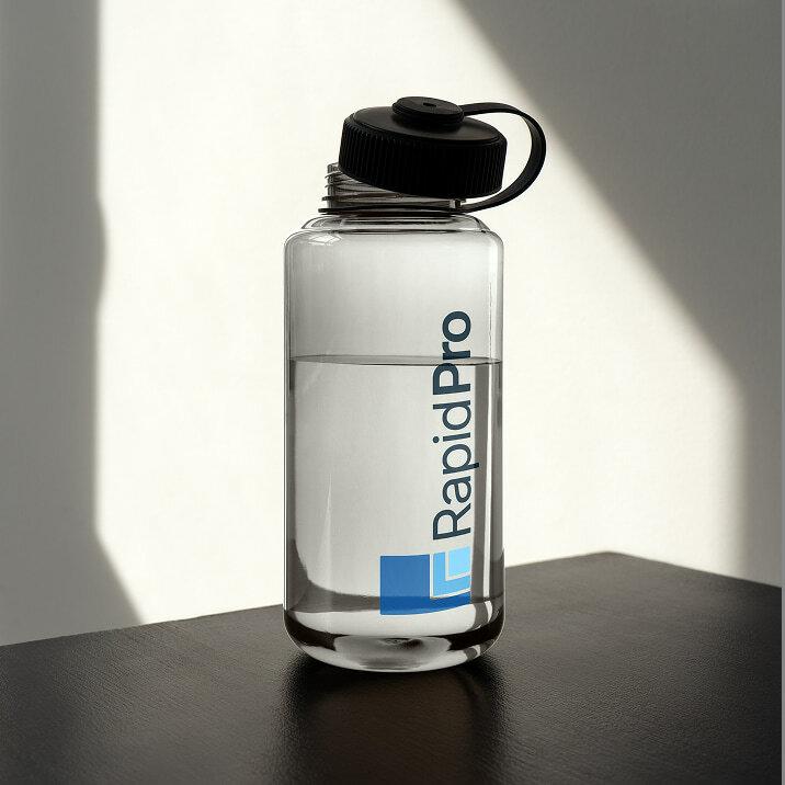 Clear RapidPro water bottle on a dark table.