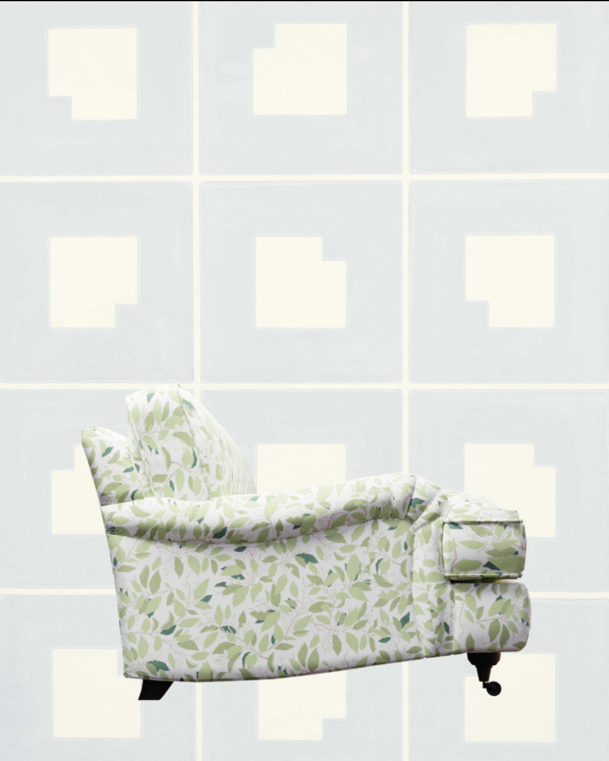 Green leaf-patterned sofa against a pale blue tiled wall