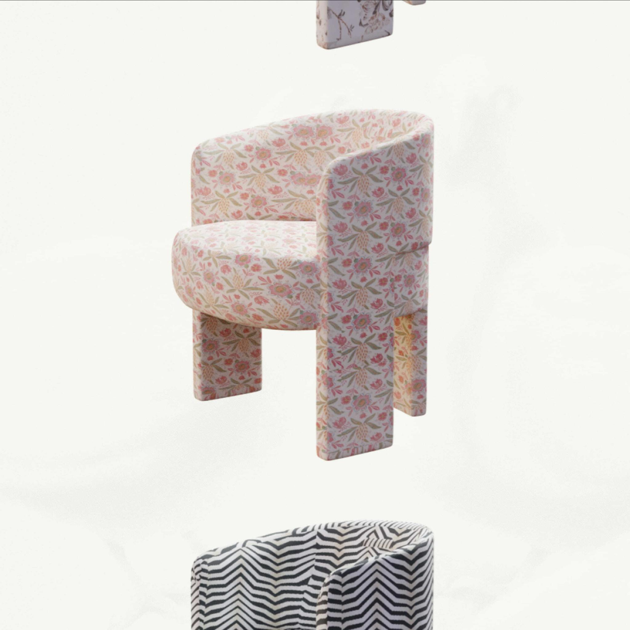 Floating upholstered chairs in floral and striped patterns on a pale background