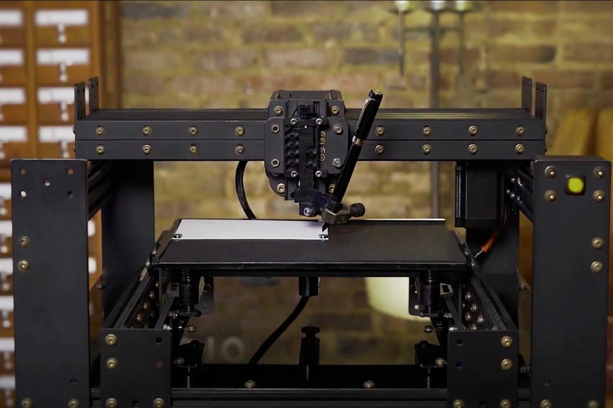 Industrial pen plotter poised over a flat writing surface