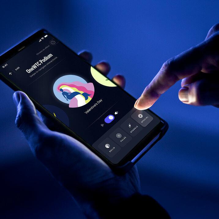 Phone app controlling a colorful lighting display in blue light