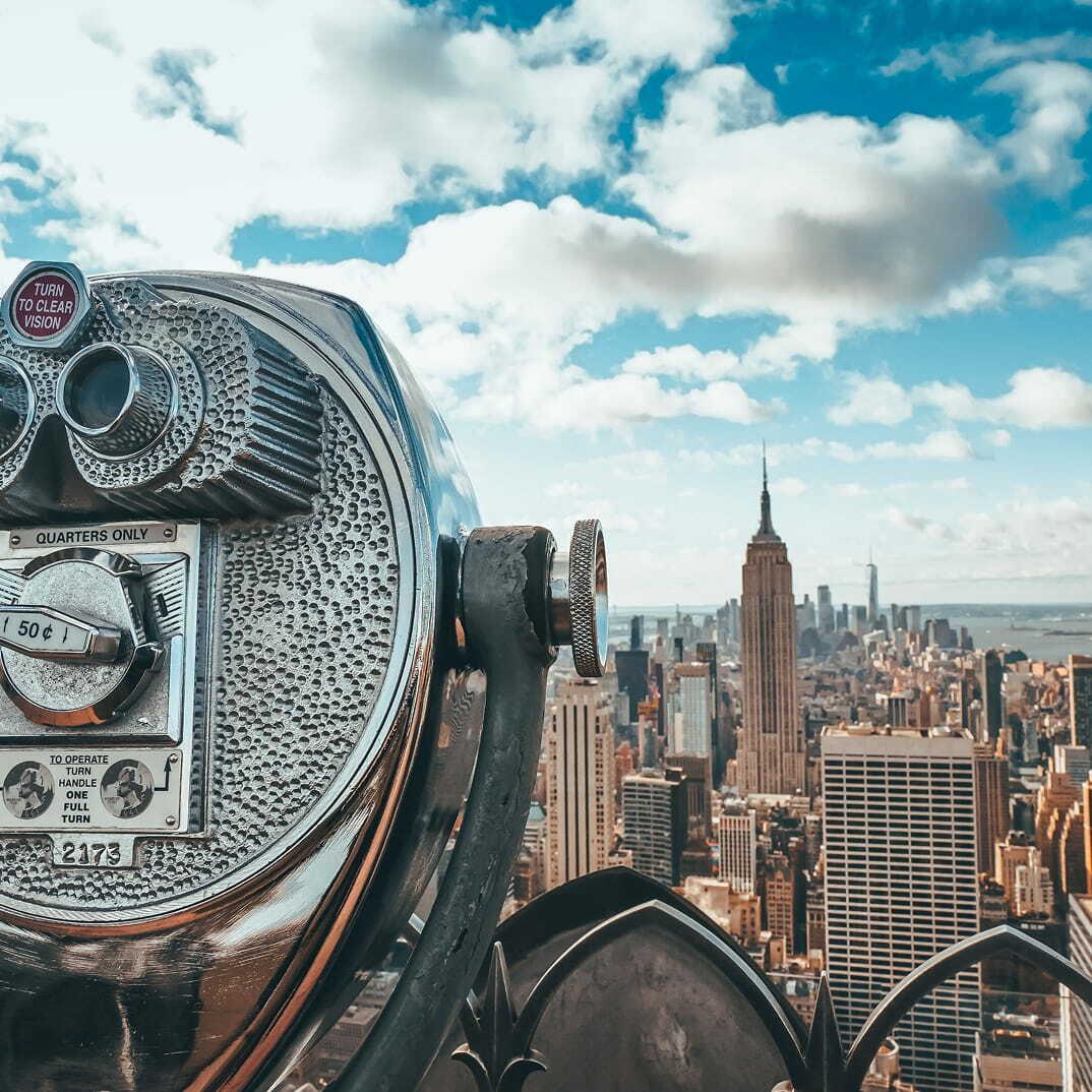 Coin-operated viewer with the New York City skyline in the background.
