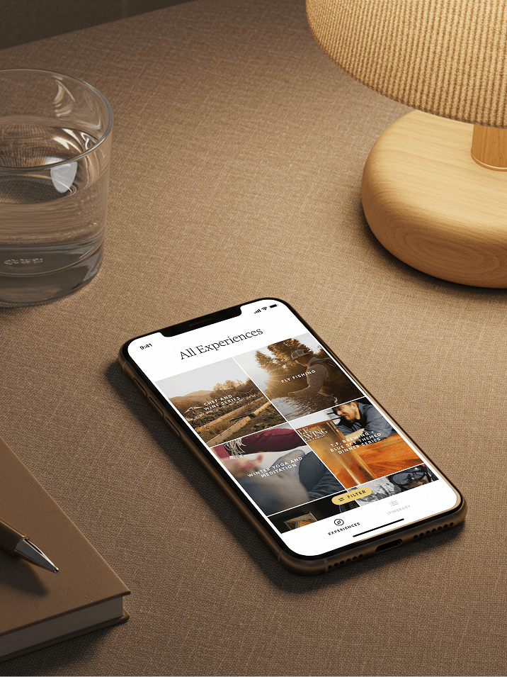Smartphone on a table showing an All Experiences app screen