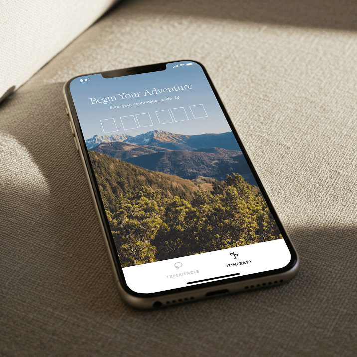 Smartphone on fabric showing a mountain adventure confirmation screen