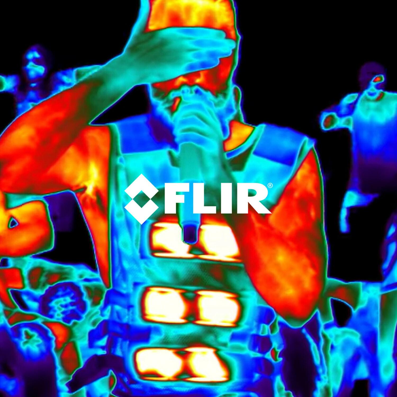 Thermal camera view of a performer with FLIR logo overlay