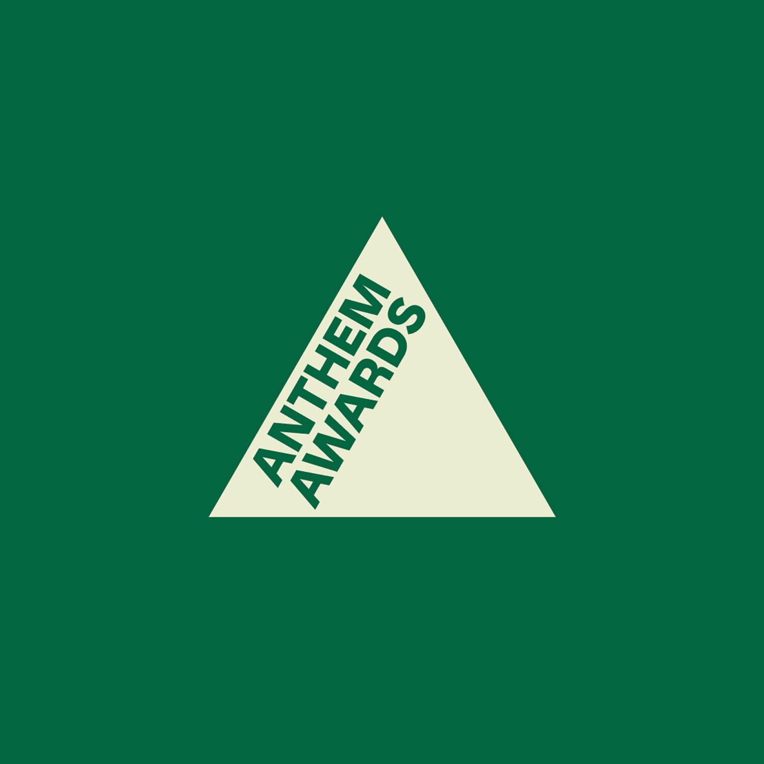 Anthem Awards logo inside a cream triangle on green
