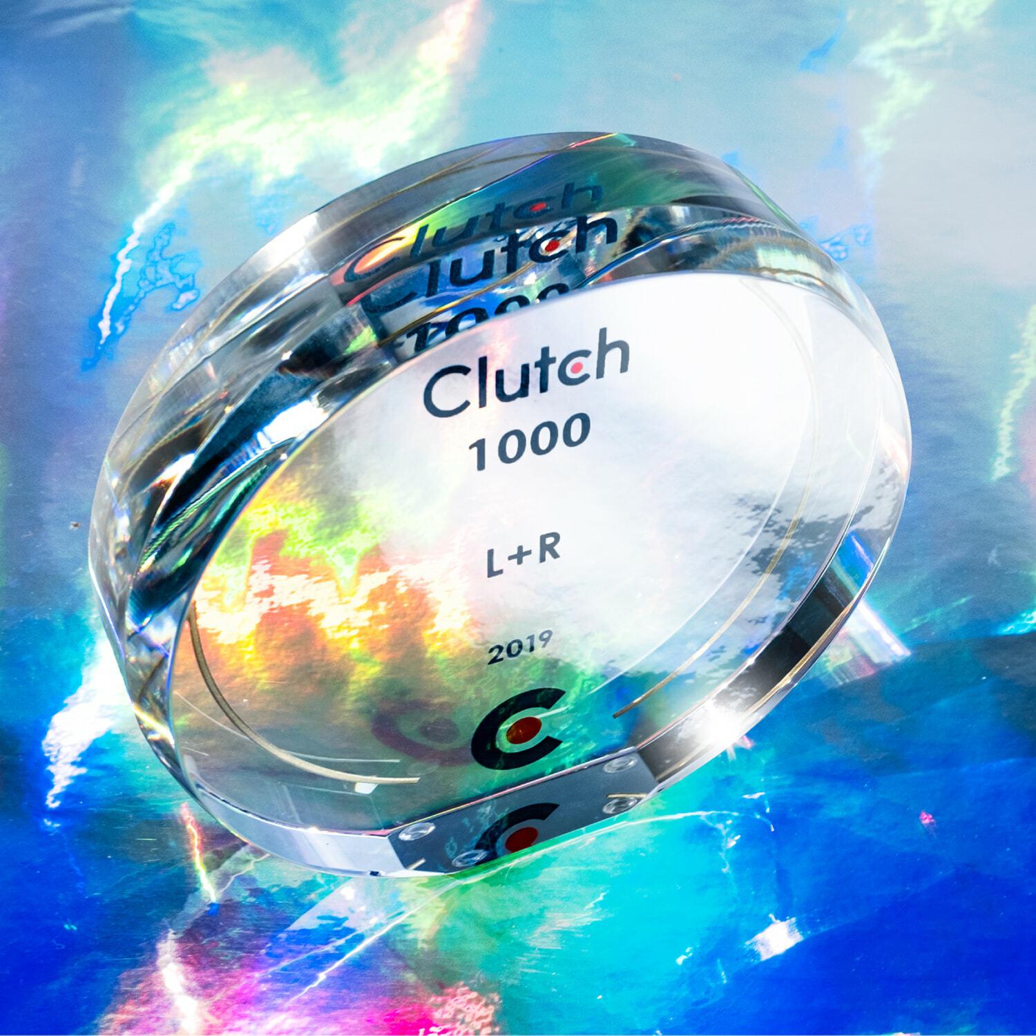 Glass Clutch 1000 L+R 2019 award on a colorful reflective surface