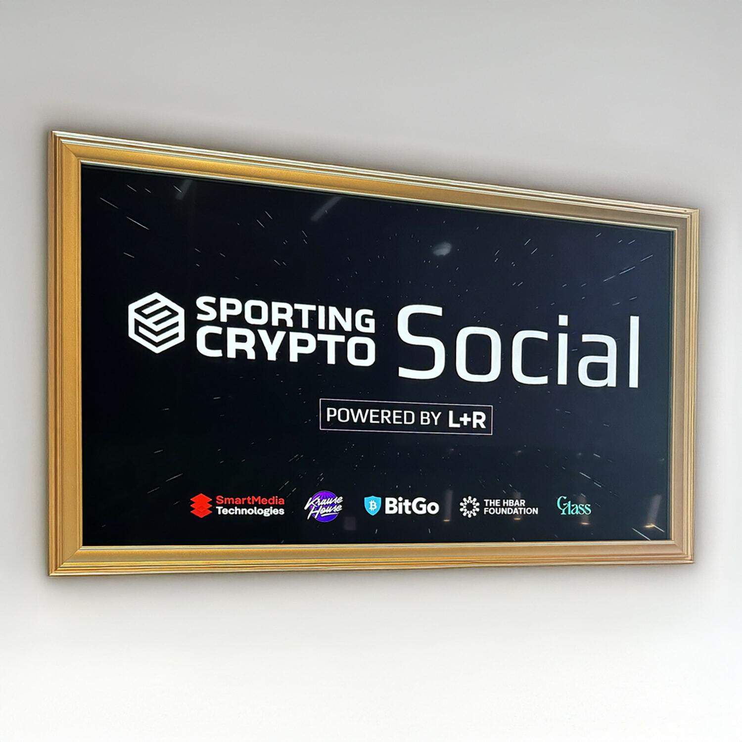 Framed Sporting Crypto Social sign powered by L+R with partner logos