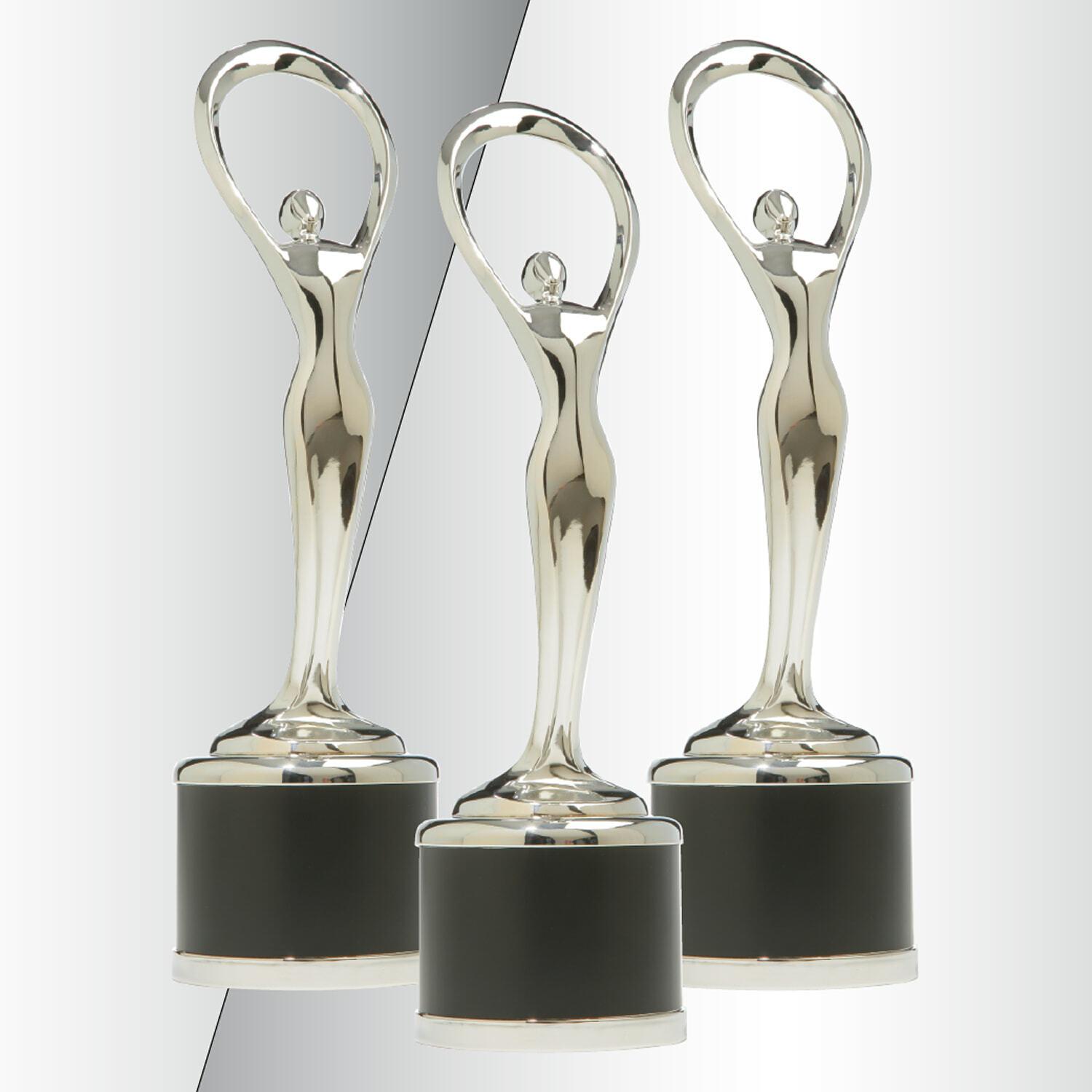 Three silver trophy statuettes on black bases