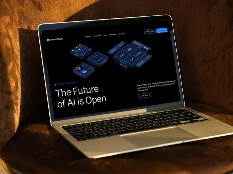 Laptop on a chair displaying "The Future of AI is Open"