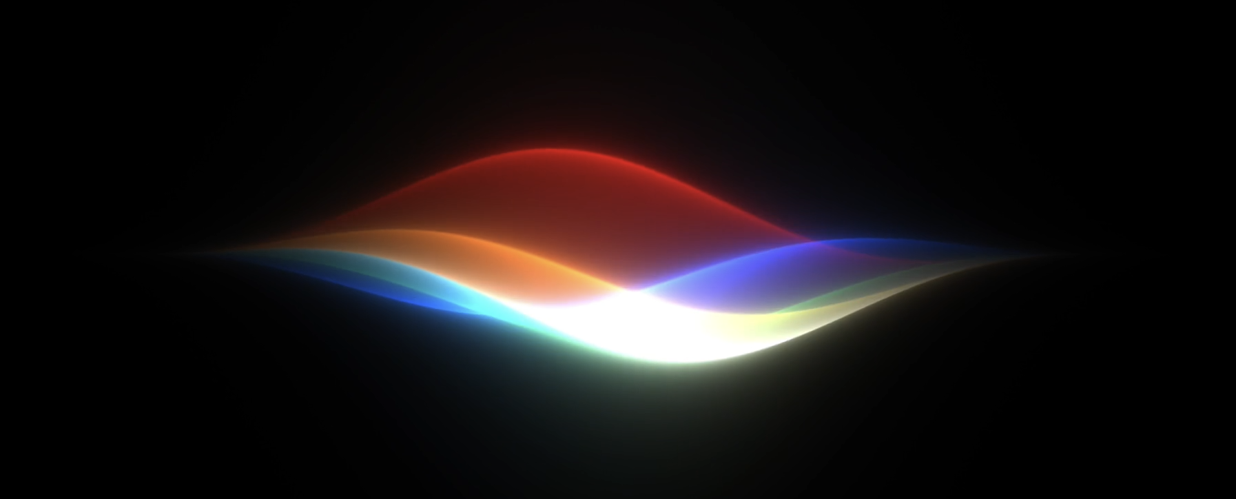 Colorful Siri glow waveform on a black background